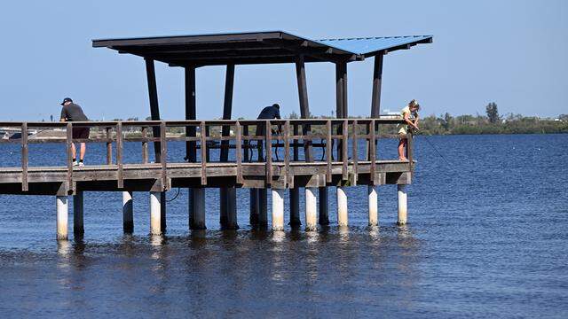 Residents enjoy the waters of the Manatee River just near the place where artist Reinaldo Correa’s public art piece, The Singing River, was installed in the Mineral Springs Park in Riverwalk East in March 2026.
